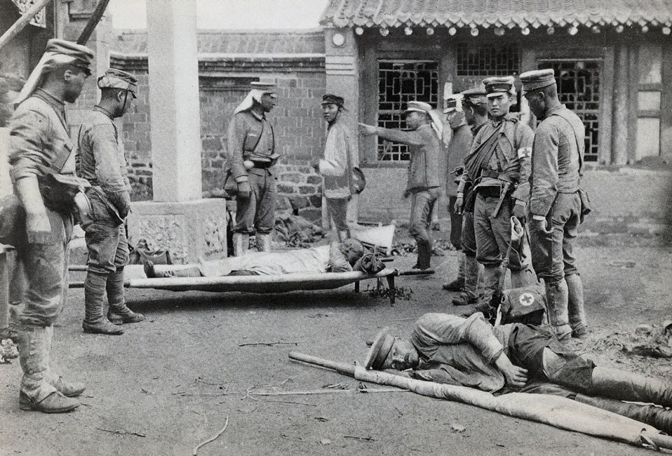 “Bringing Wounded Russians to the Dressing Station at the Kwantei Temple on July 4” page 112, A Photographic Record of the Russo-Japanese War, Edited by James H. Hare 1905, PF Collier & Son, New York