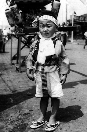 5 years old in my festival outfit: head gear and Happi coat.