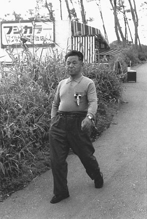 Tatsu Go-Ro walking in the Suka district which is near the wharf.