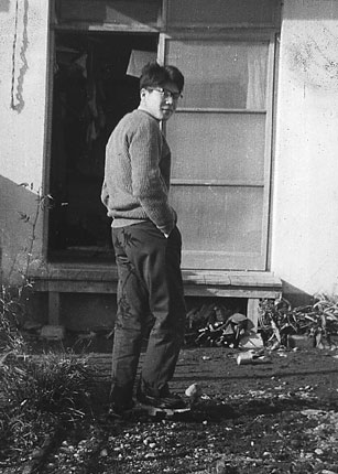 Hiroshi in the muddy back yard, wearing geta.