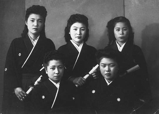 Mitsuko (center) graduation from Kyoritsu Women’s College in Tokyo, 21 years old.