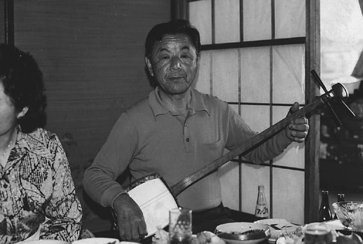 My Suka grandfather, Tatsu Go-Ro, playing shamisen at home