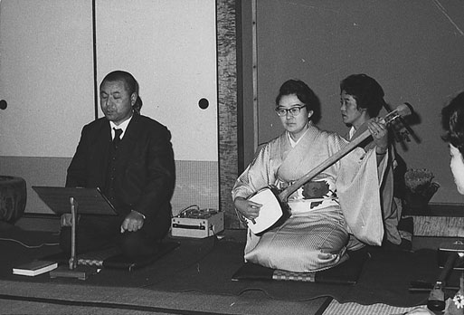 Tatsu Go-Ro sings while his teacher plays shamisen in a class recital.